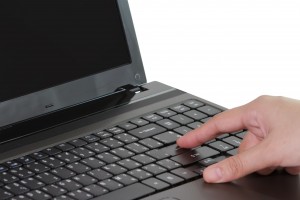 Brand touch - finger reaching out to keyboard
